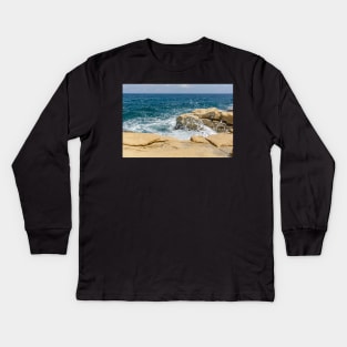 Wave breaks on rocks of the Sliema coast Kids Long Sleeve T-Shirt